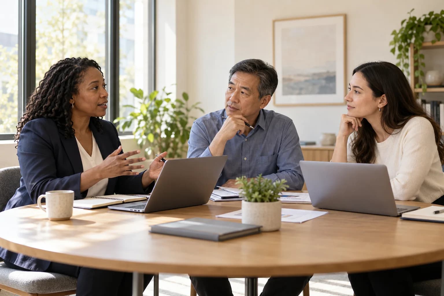 Illustrative scene of three finance professionals learning together in a small working session